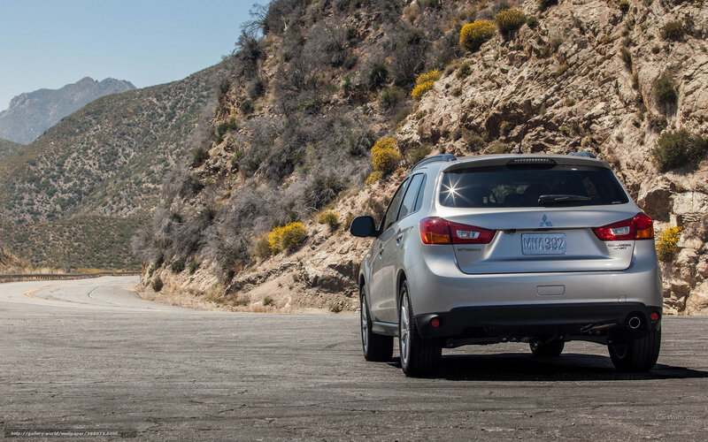 Silver SUV on mountain road