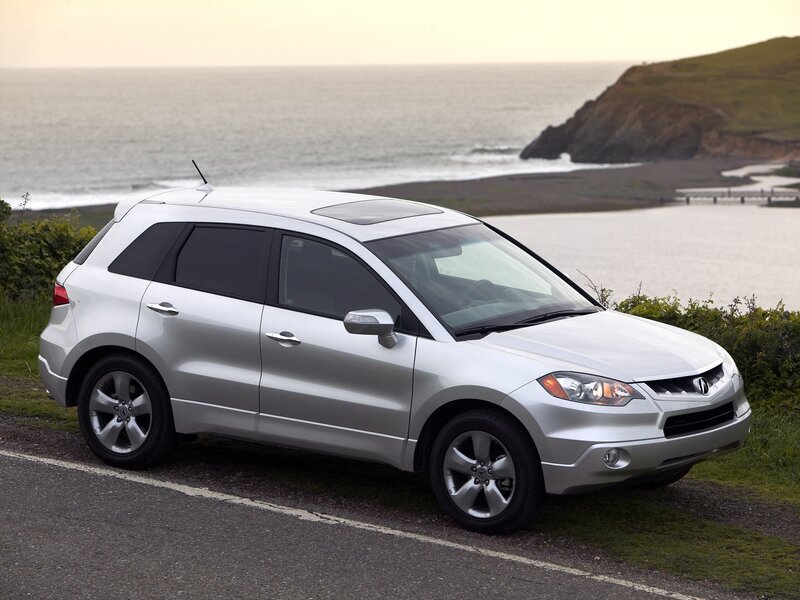 Silver SUV on Road — Serene, Sunset, Photograph, Ocean