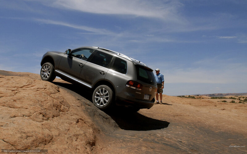 Silver Suv on Rock