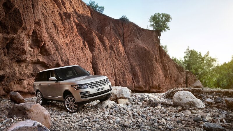 Silver SUV on Rocks — Brown