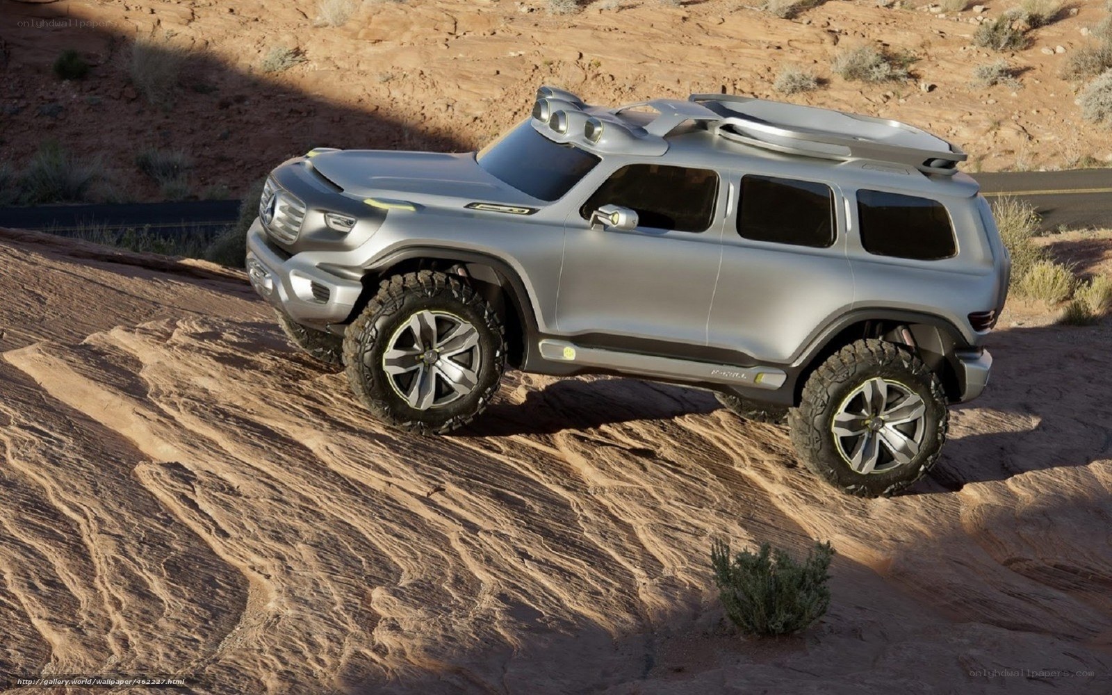 Silver SUV on rocky terrain
