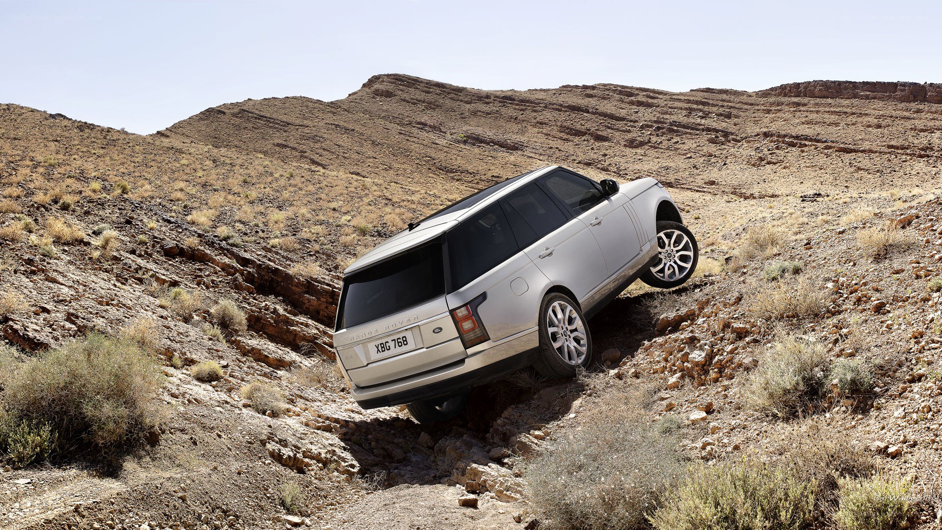 Silver SUV on rocky terrain
