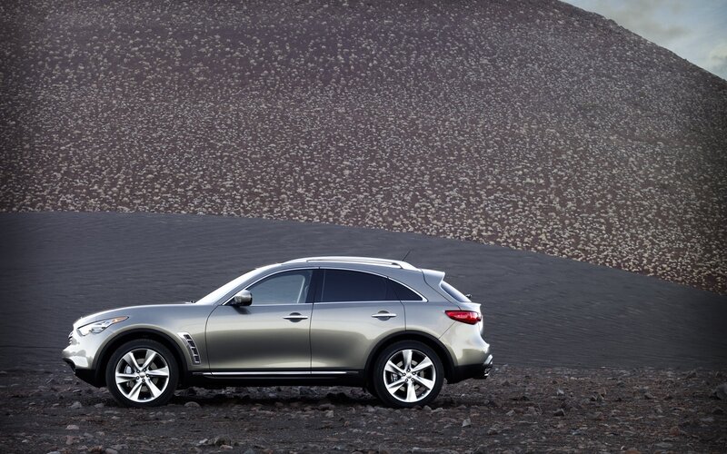 Silver Suv on Rocky Terrain — Gray, Dramatic