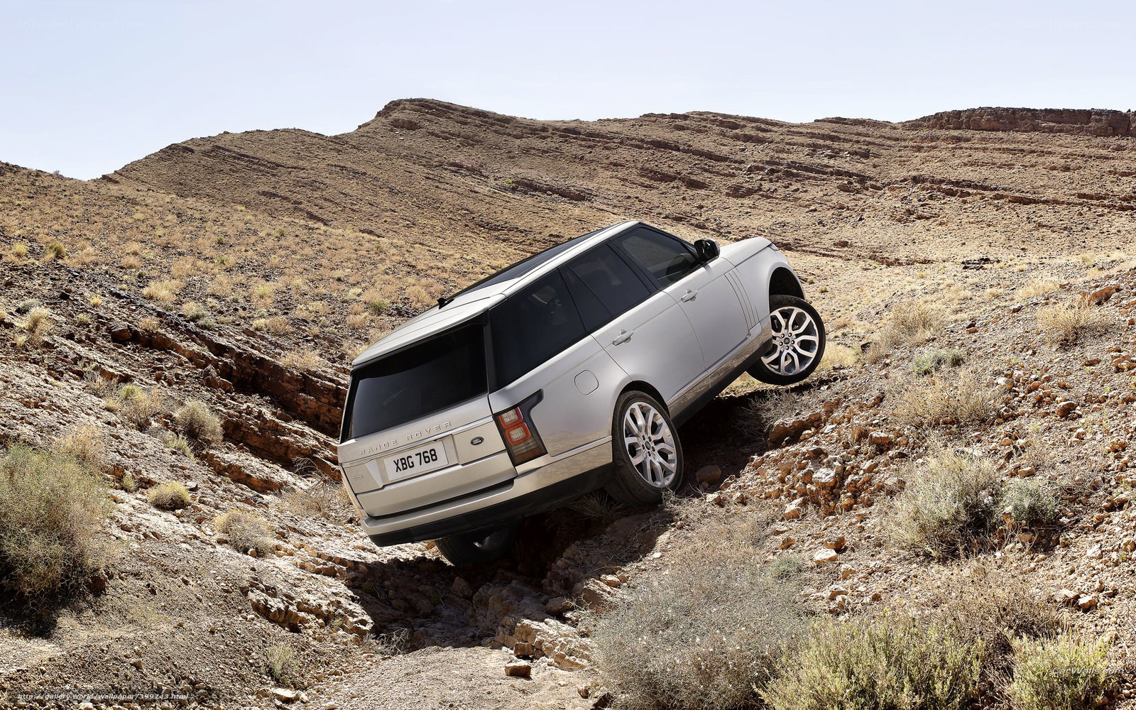 Silver SUV on rocky terrain