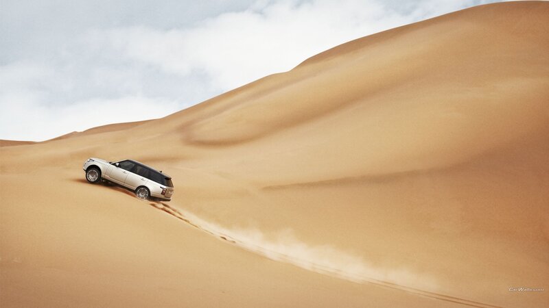 Silver SUV on Sand Dune — Brown