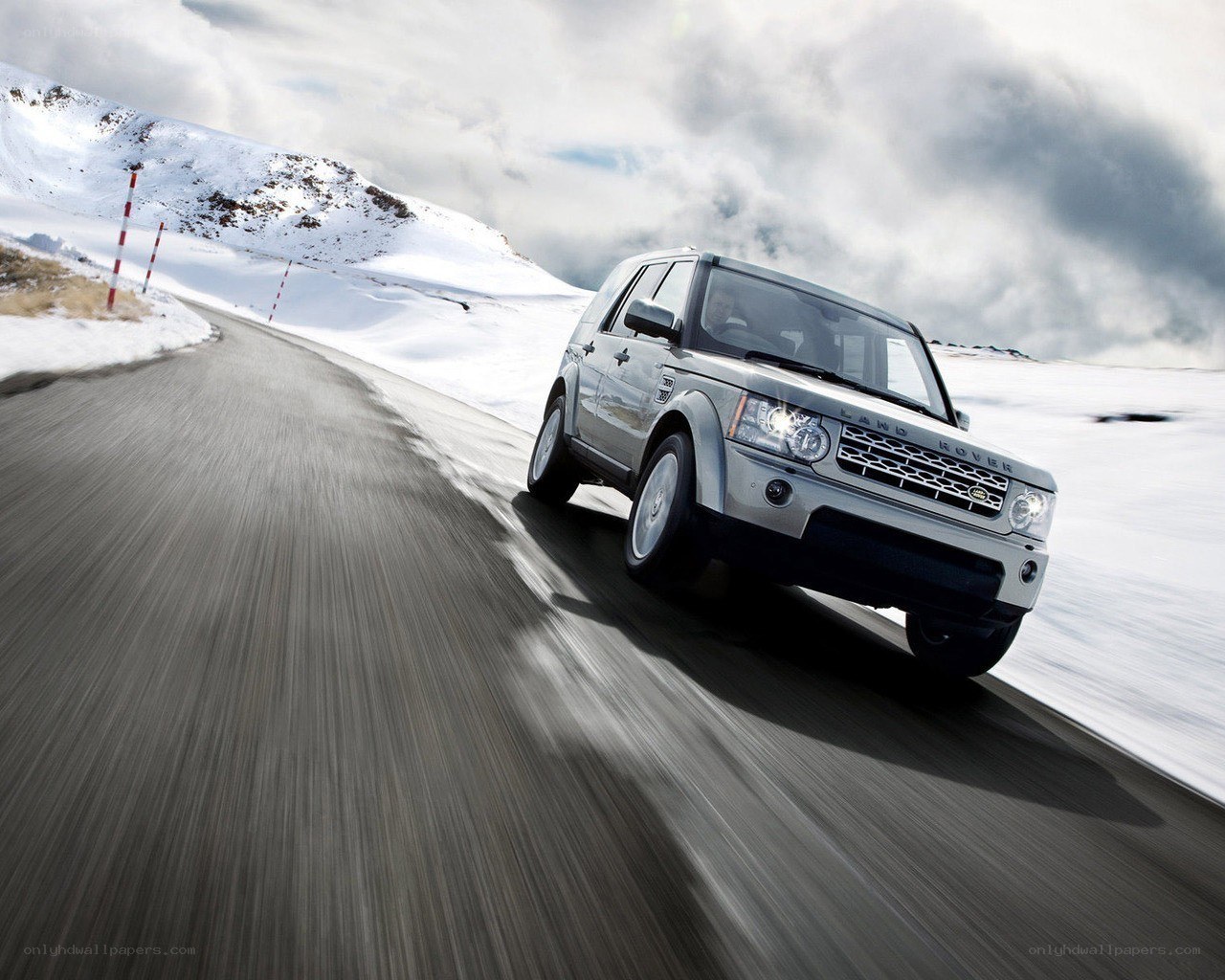 Silver SUV on snowy road