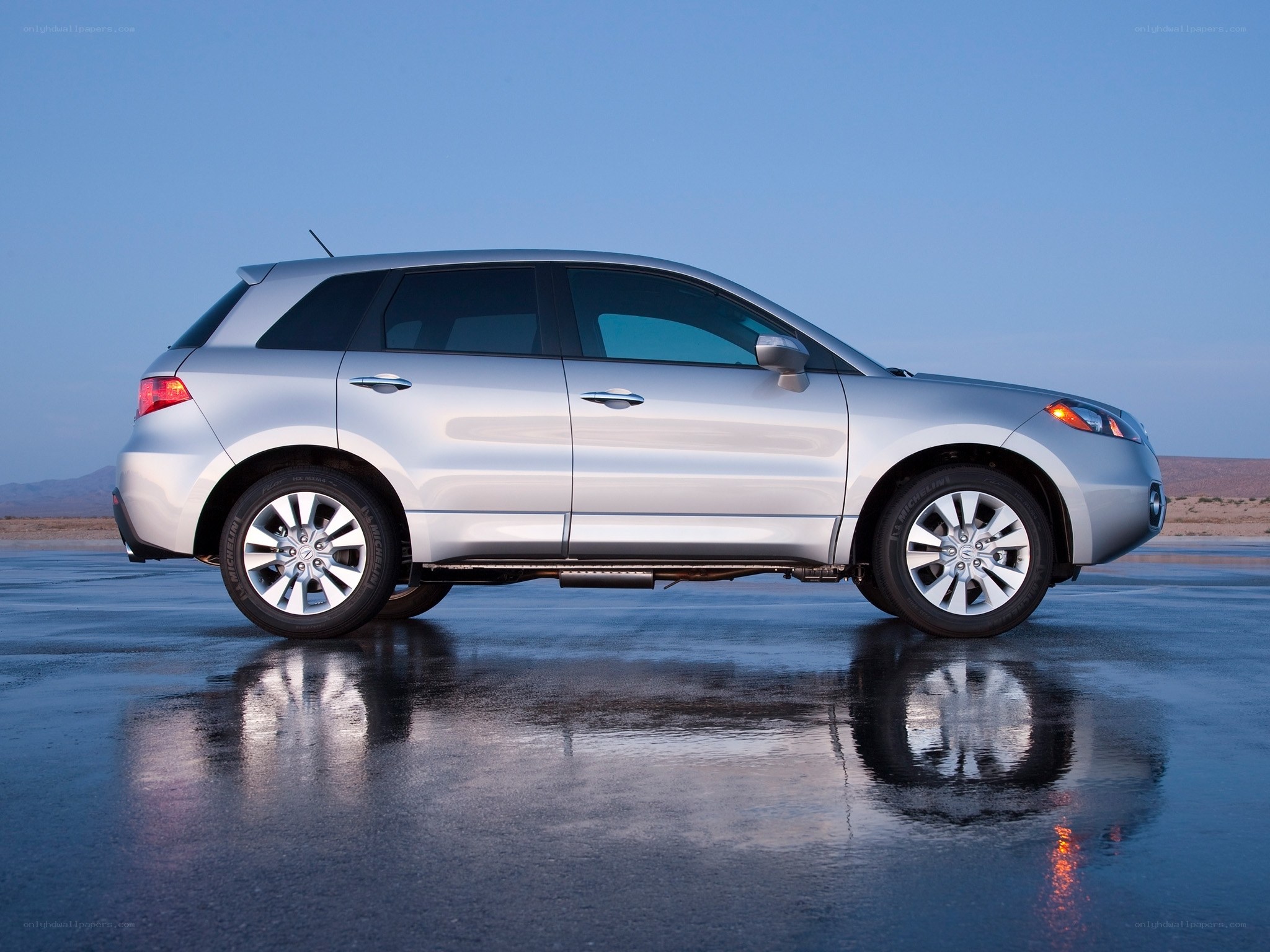 silver suv on wet pavement
