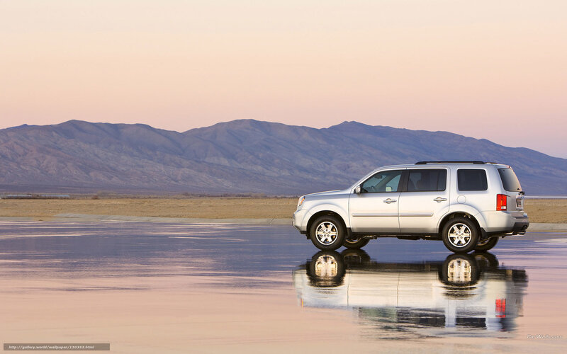 Silver SUV on wet pavement