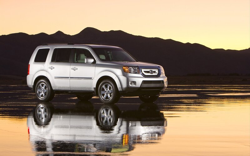 Silver SUV on wet surface