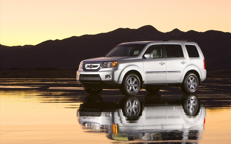 Silver SUV on wet surface