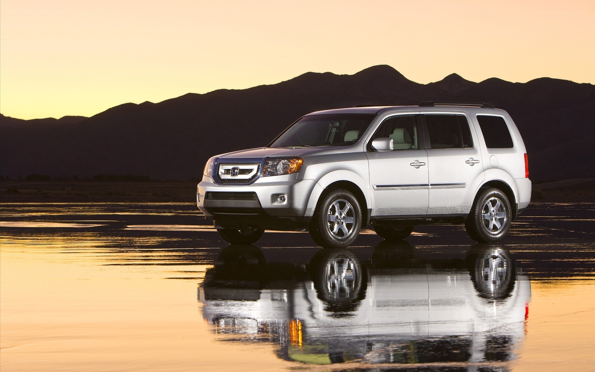 Silver SUV on wet surface