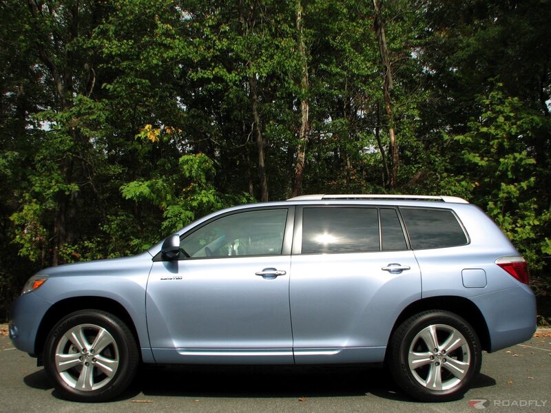 silver suv parked in forest