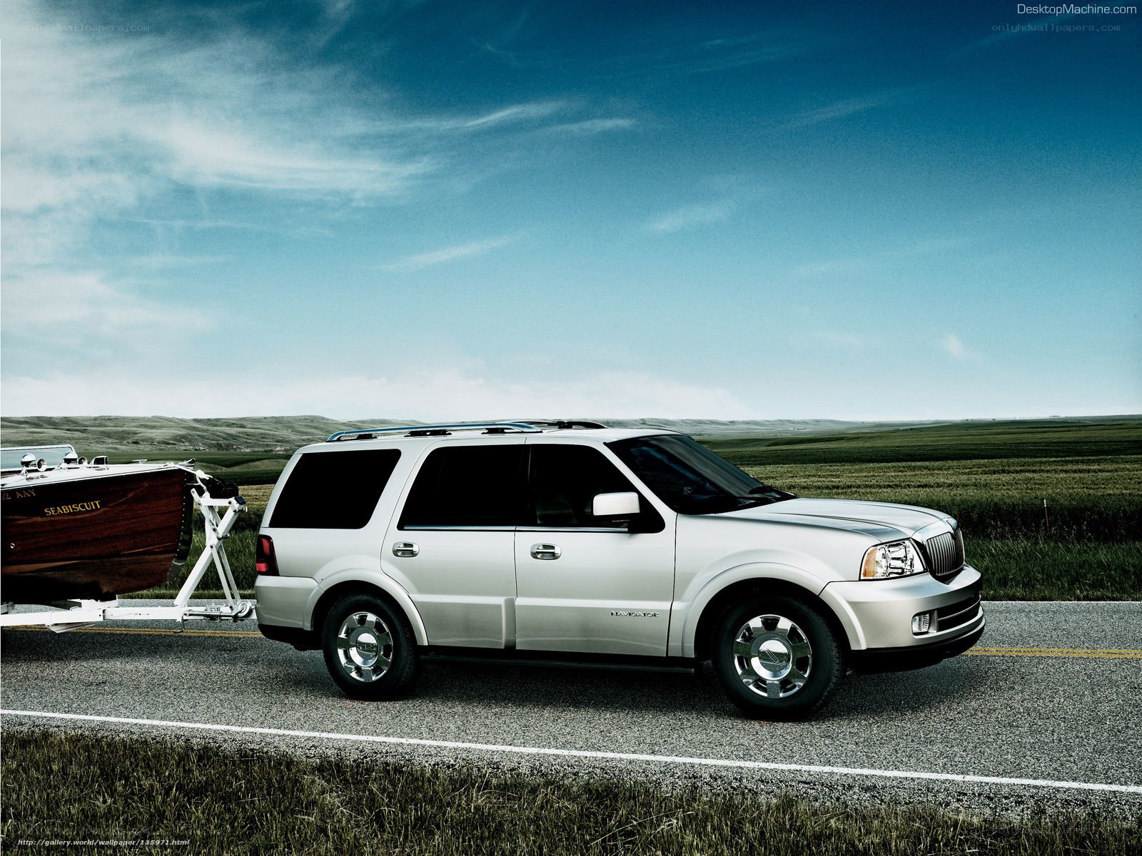Silver SUV towing a boat