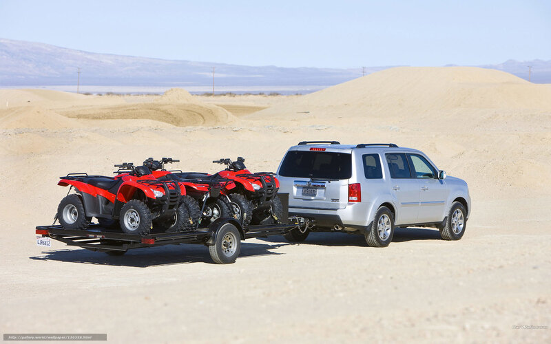 Silver Suv Towing Atvs