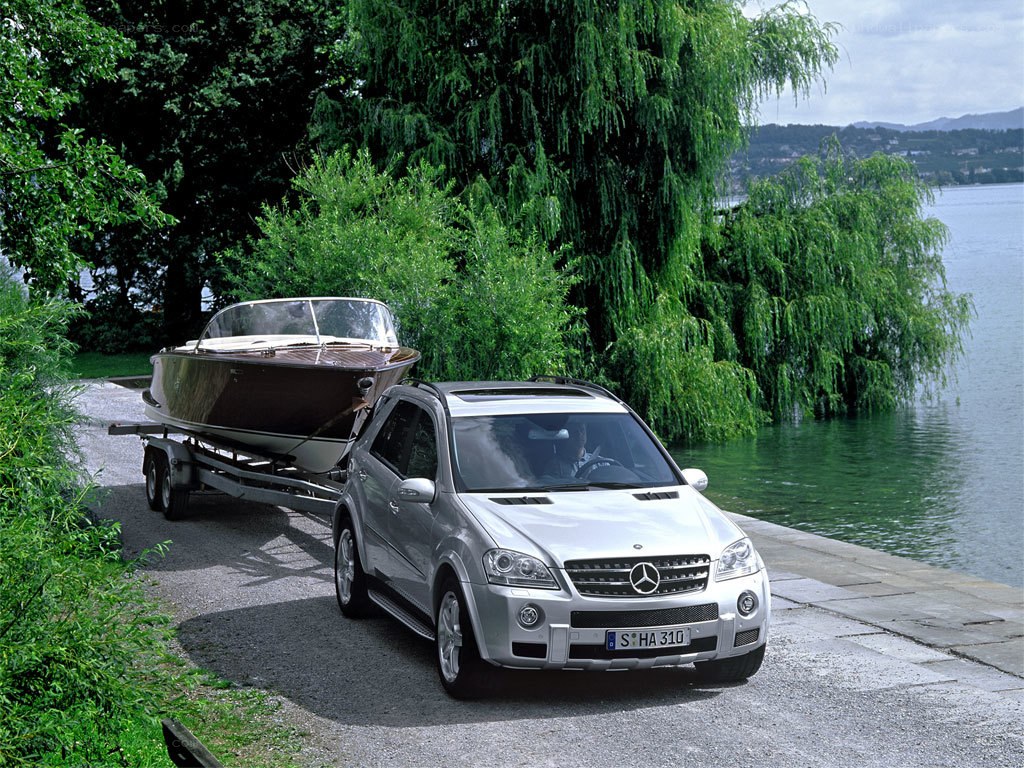 Silver SUV towing boat