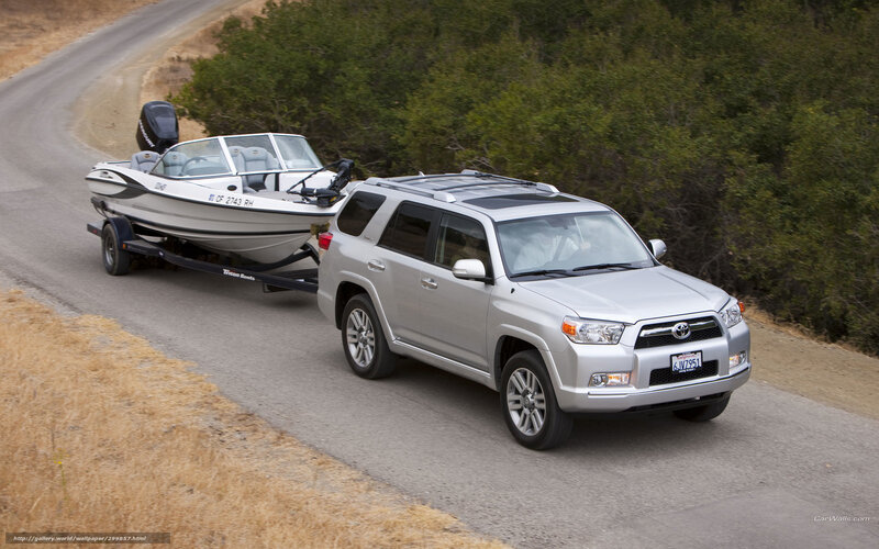 silver suv towing boat