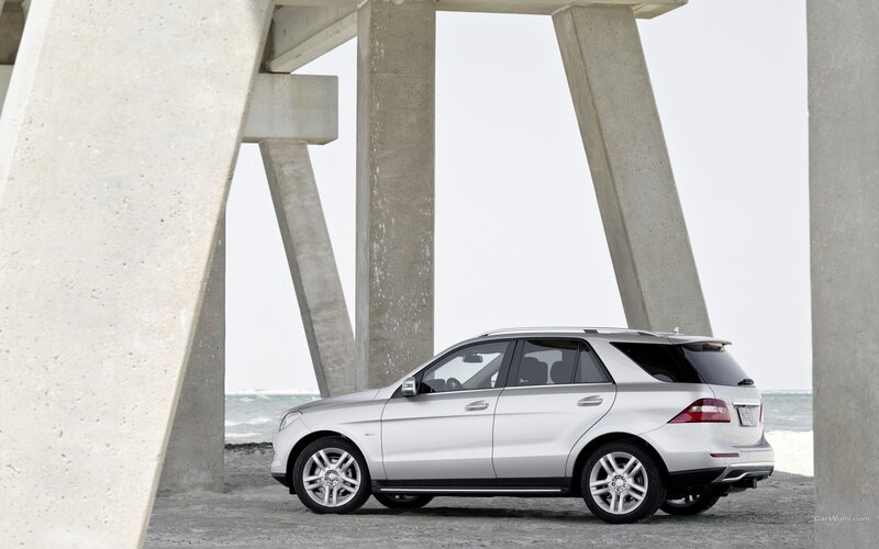 silver suv under pier