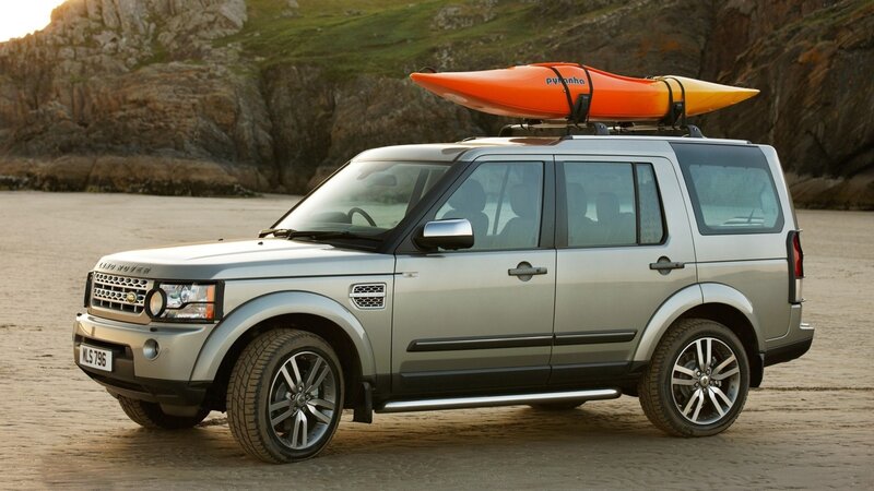 Silver SUV with kayak on roof