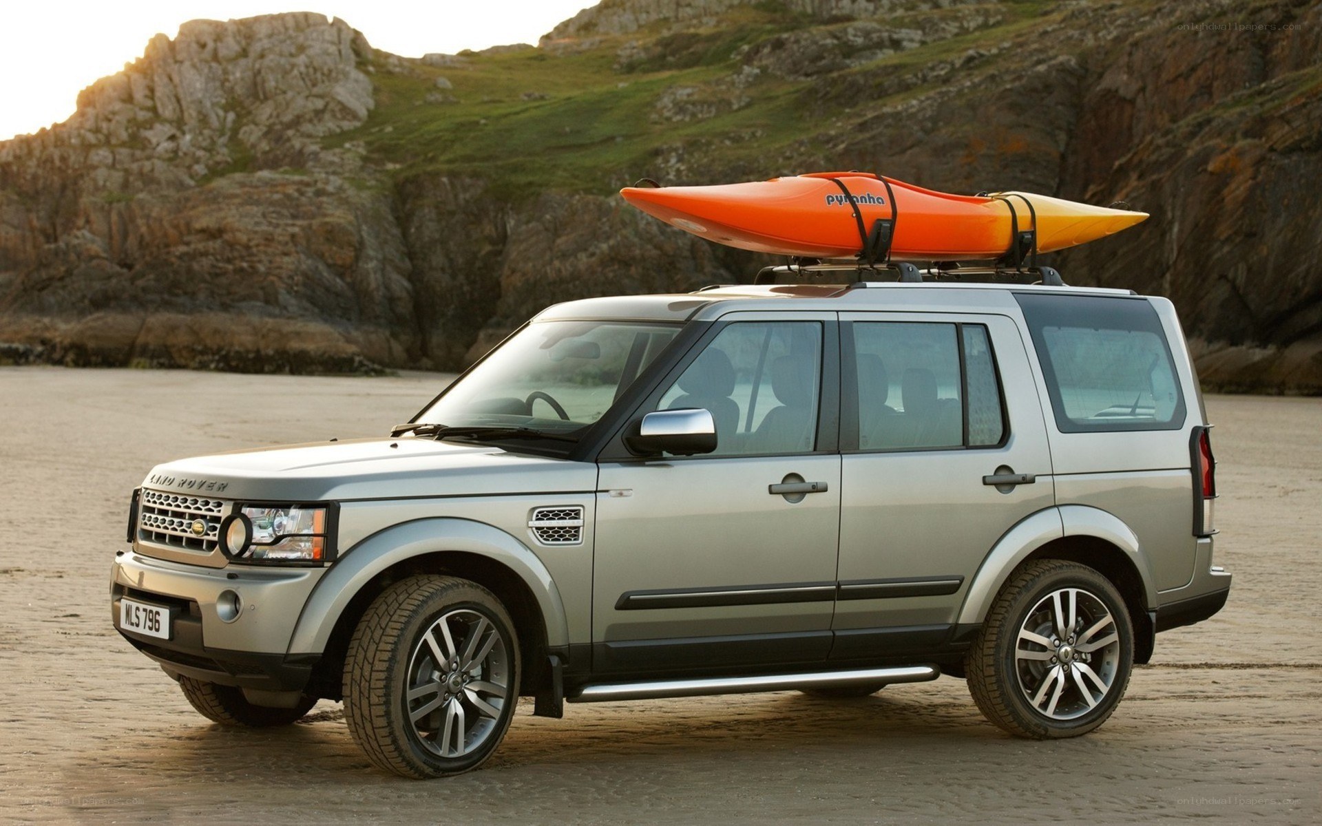Silver SUV with kayak on roof