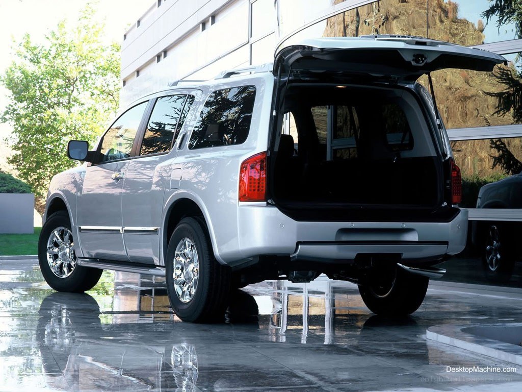 silver suv with open trunk
