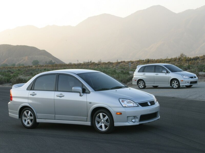 Silver Suzuki cars on road