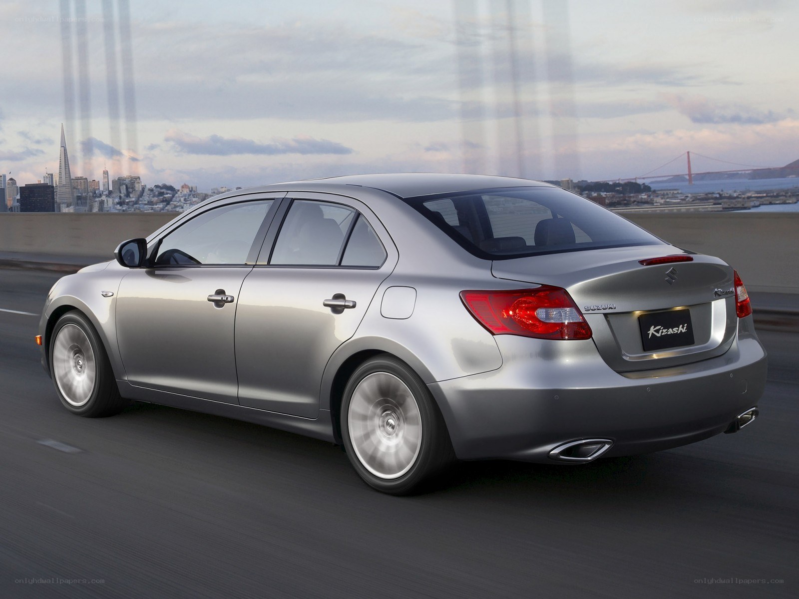 silver suzuki kizashi on a bridge