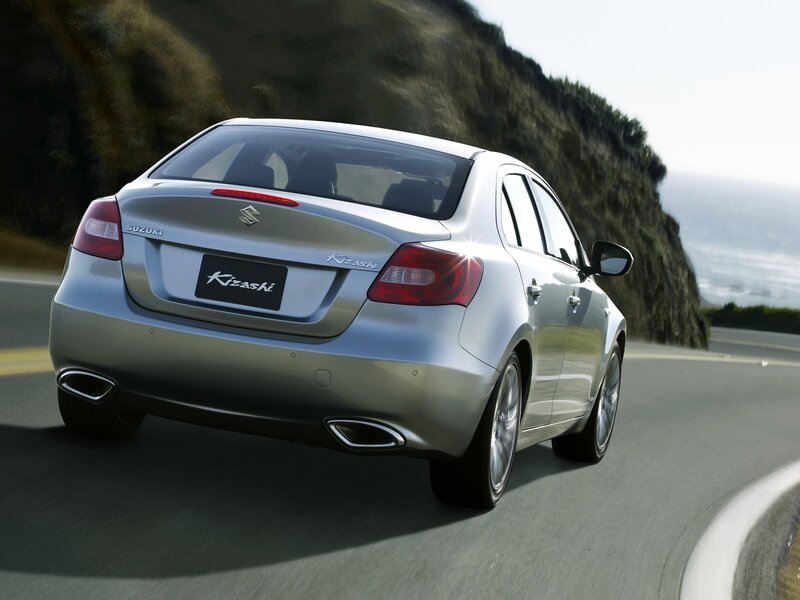 Silver Suzuki Kizashi on coastal road