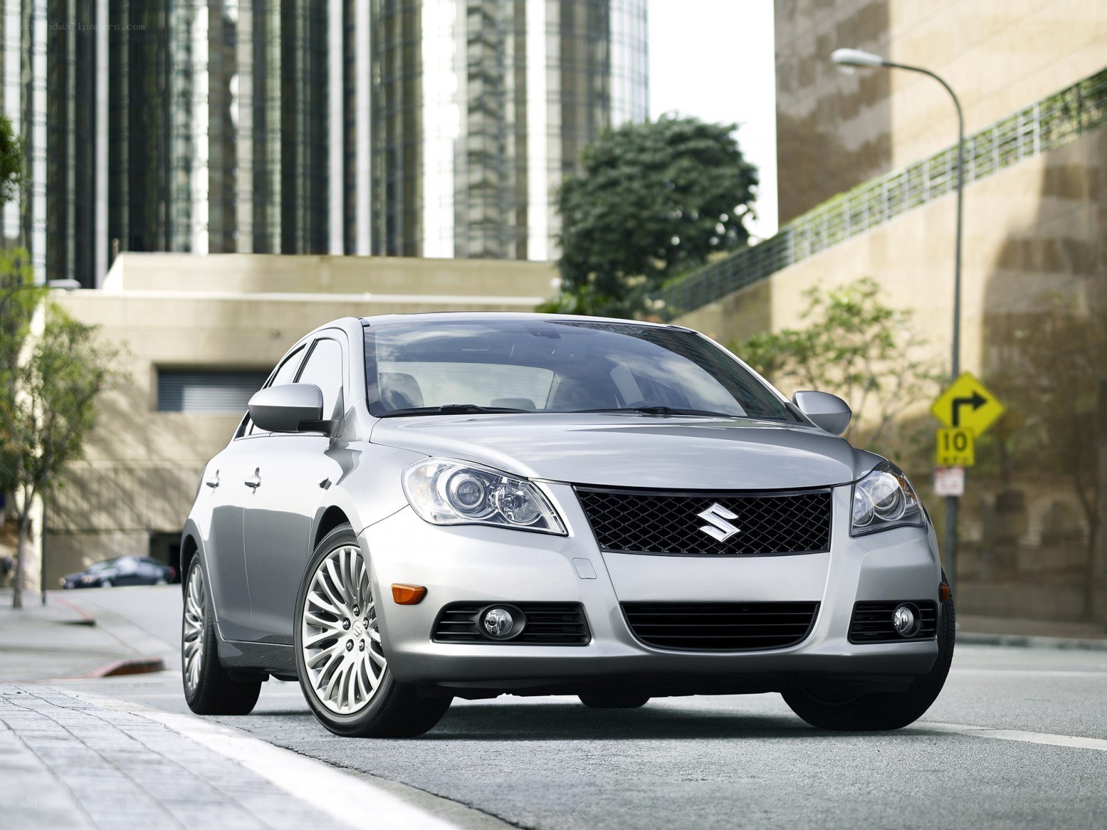 Silver Suzuki sedan in city