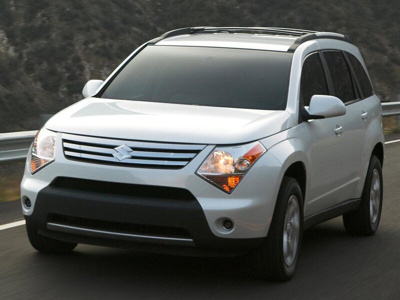 silver suzuki suv on road