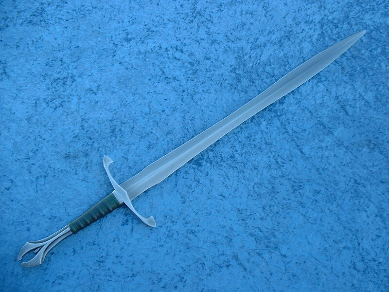 silver sword on blue surface
