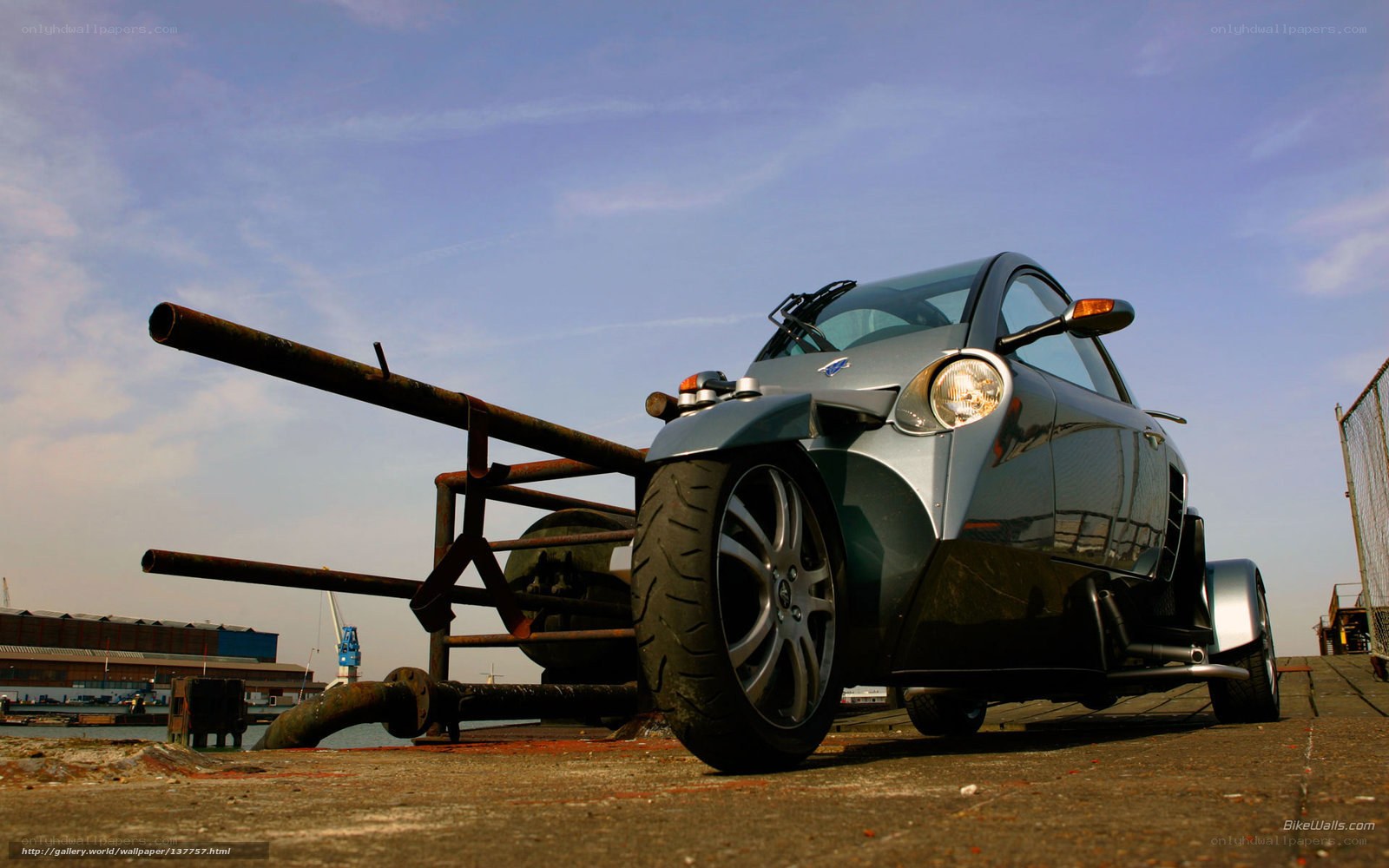 Silver three-wheeled car at harbor