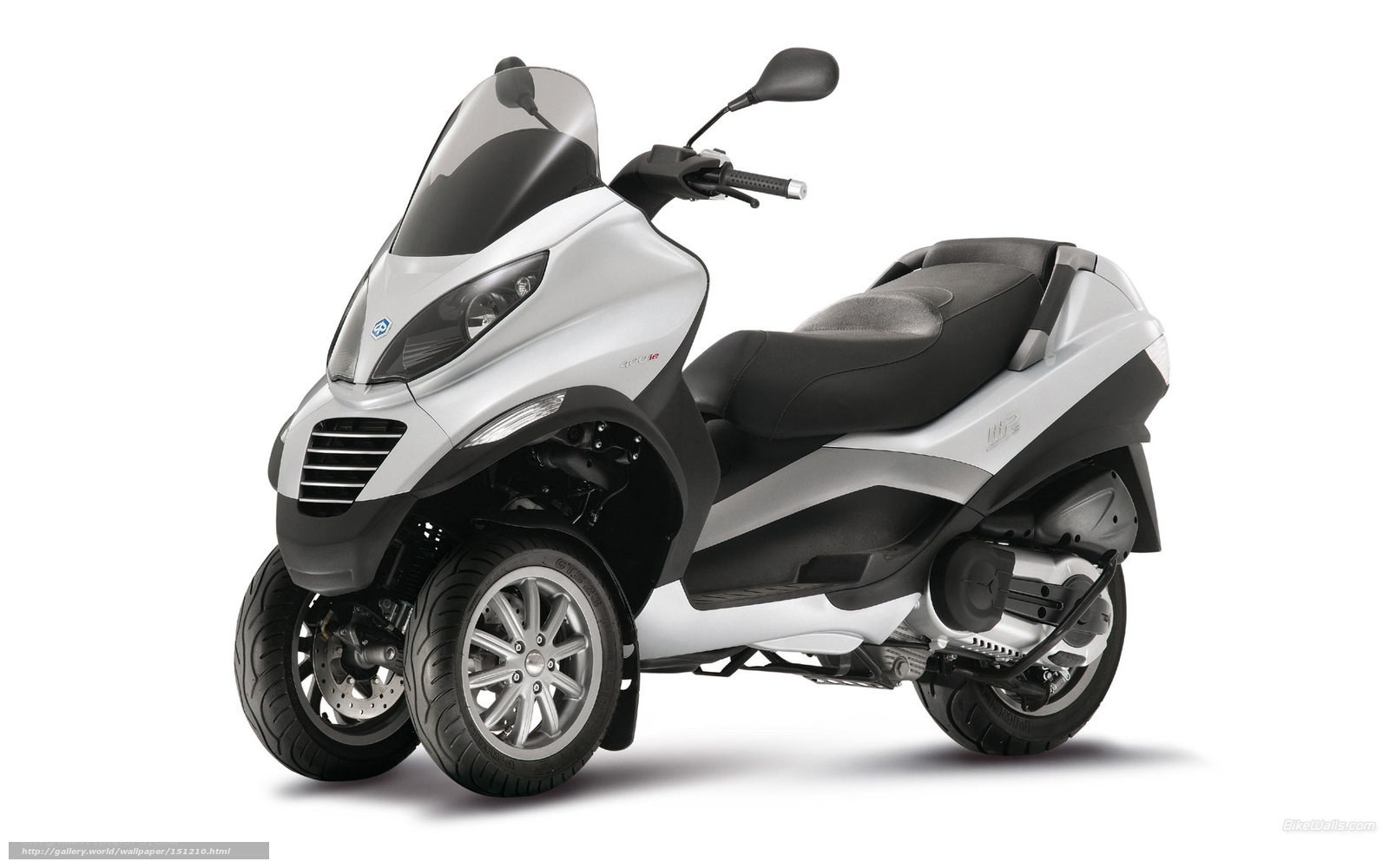 Silver three-wheeled scooter