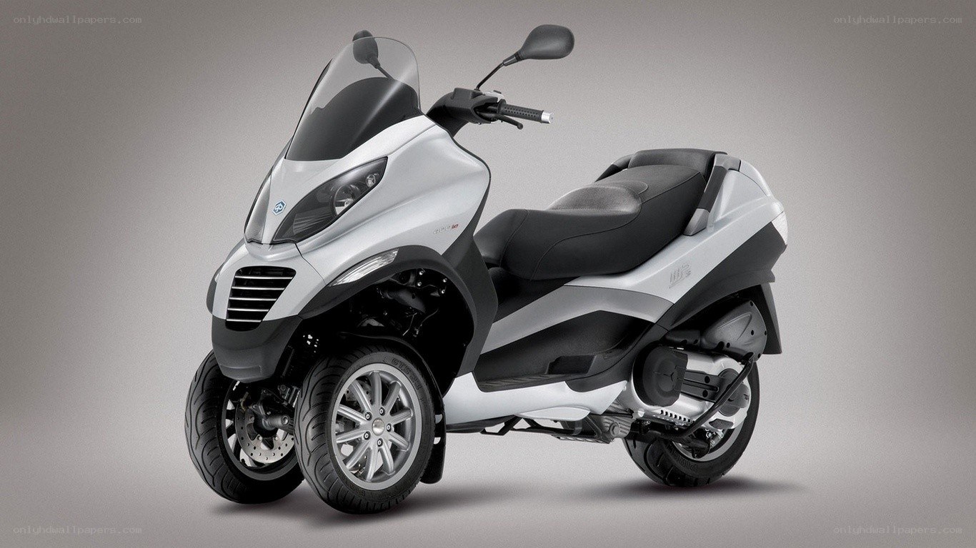 Silver three-wheeled scooter
