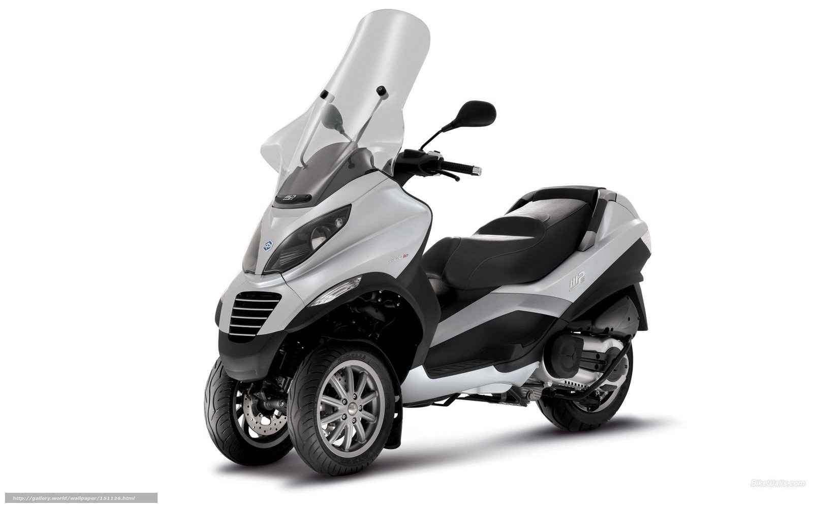 Silver three-wheeled scooter