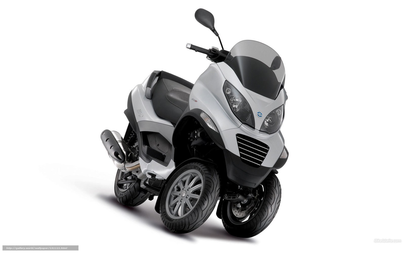 Silver three-wheeled scooter