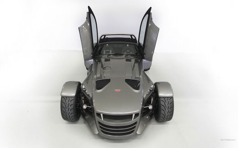 silver three-wheeled sports car