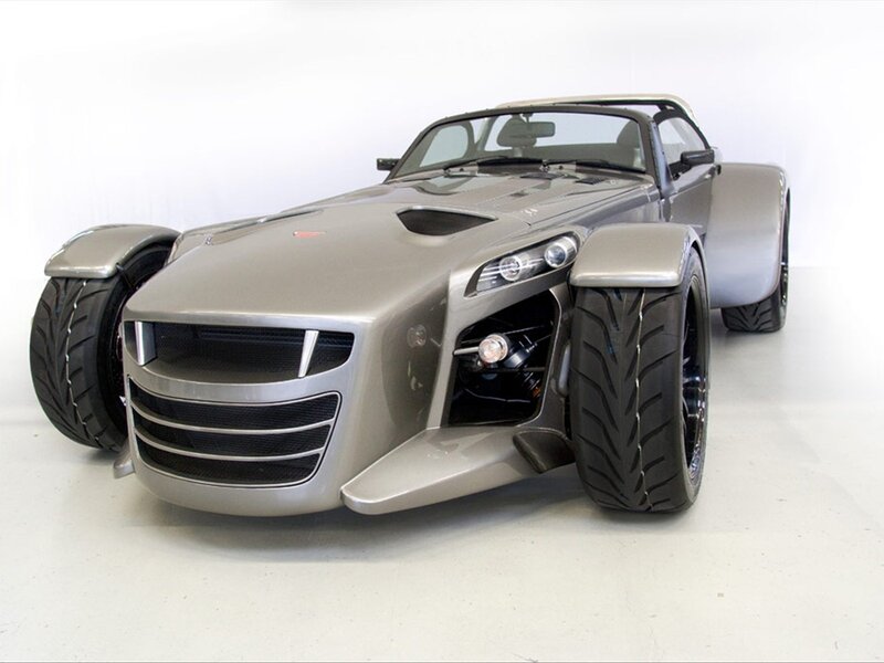 silver three-wheeled sports car