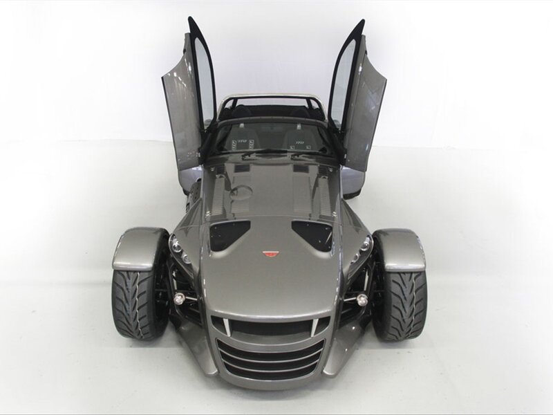 Silver three-wheeled sports car