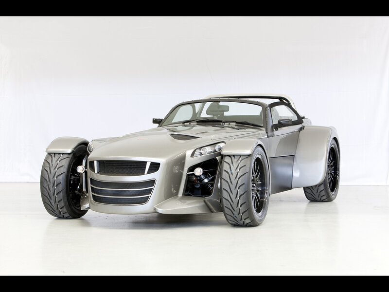 silver three-wheeled sports car