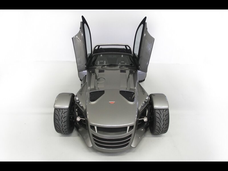 Silver three-wheeled sports car