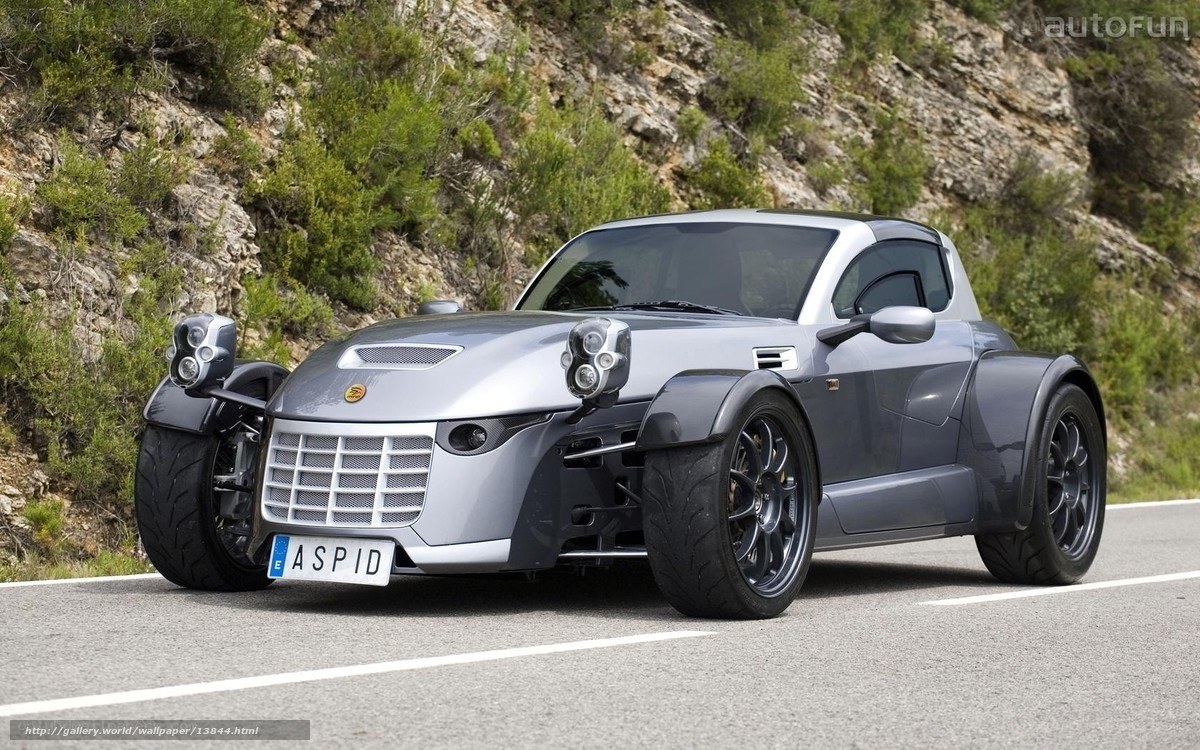 silver three-wheeled sports car