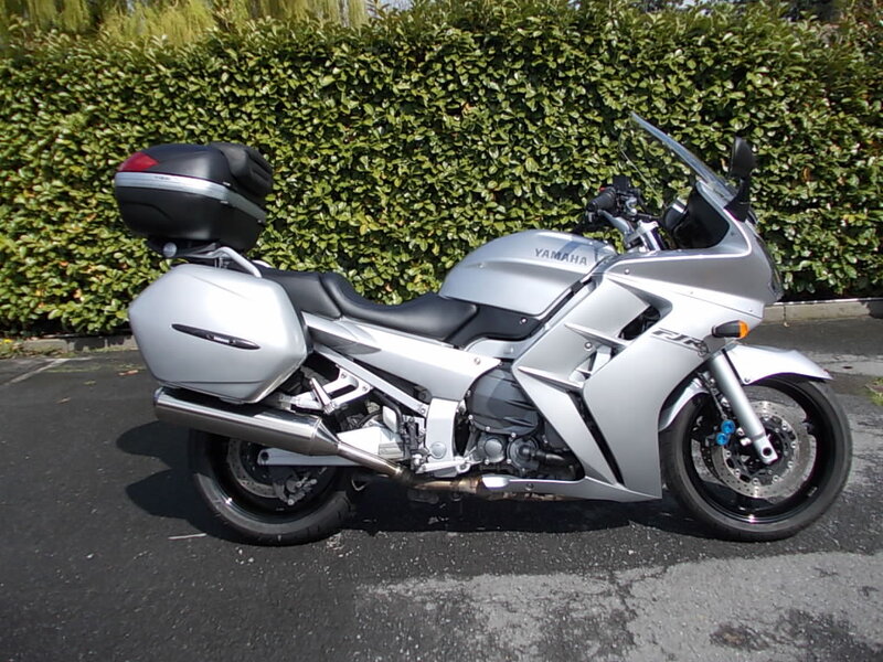 Silver Touring Motorcycle — Calm, Afternoon, Photograph, Hedge