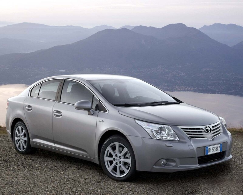 Silver Toyota Avensis on a mountain overlook