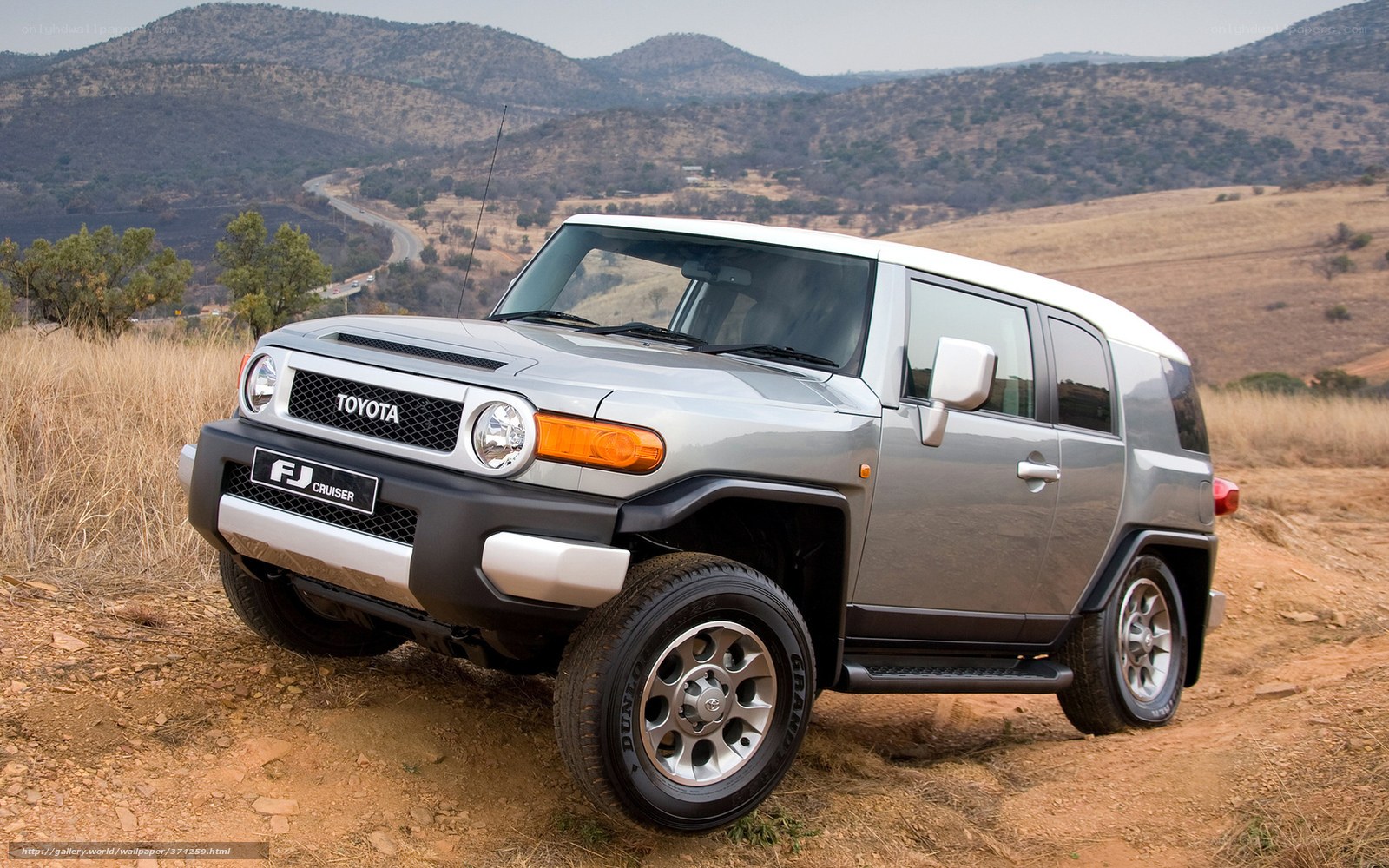 Silver Toyota FJ Cruiser on a dirt road