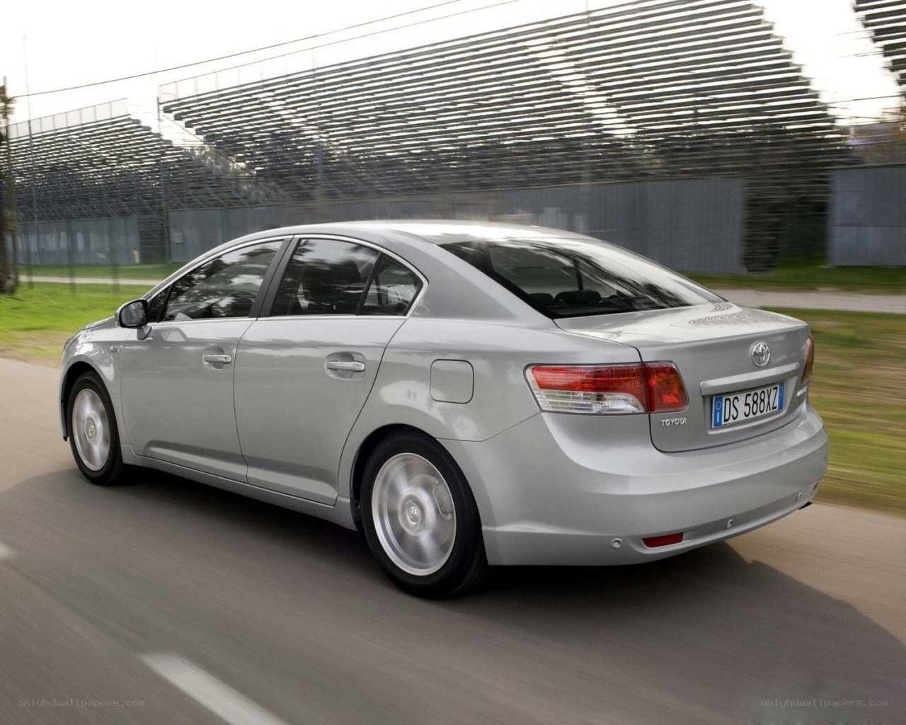silver toyota in motion
