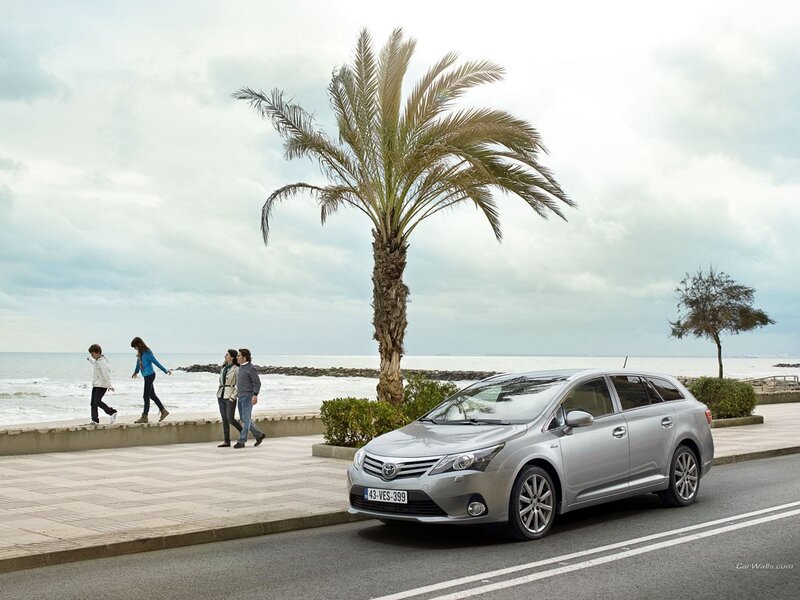 Silver Toyota on a coastal road