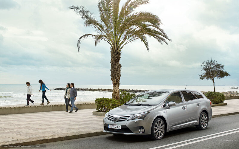 Silver Toyota on a coastal road