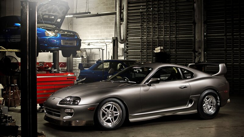 Silver Toyota Supra in garage
