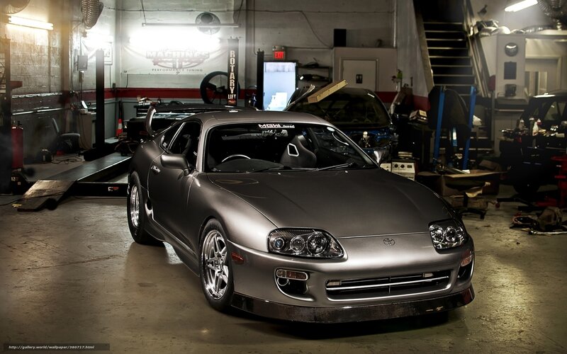 Silver Toyota Supra in garage