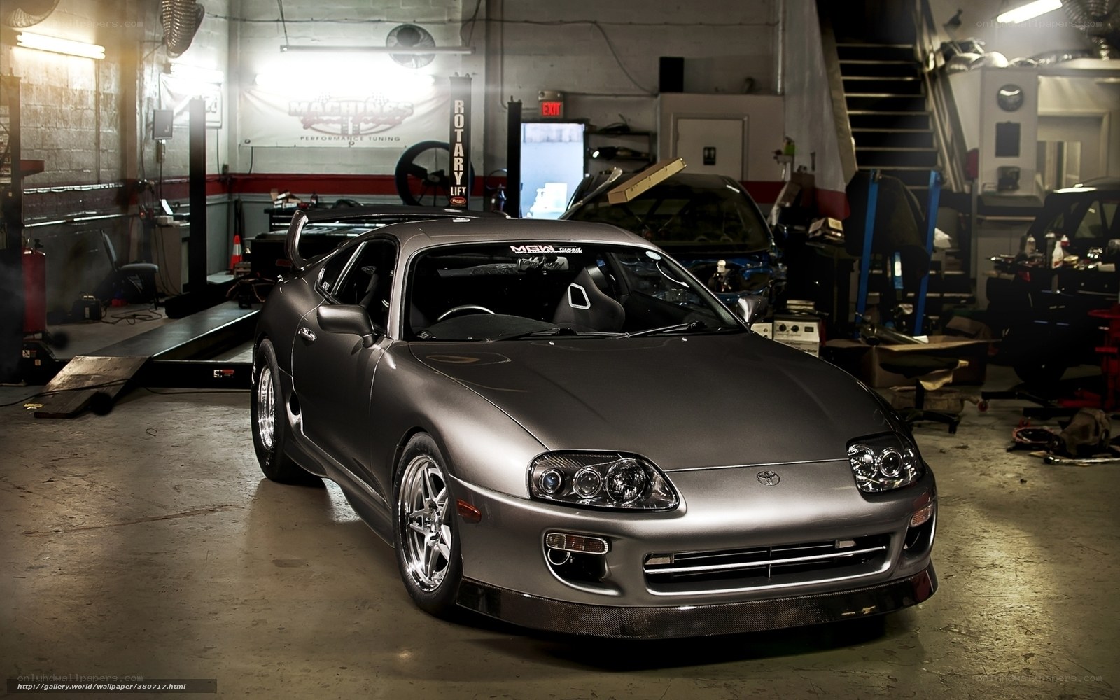 Silver Toyota Supra in garage